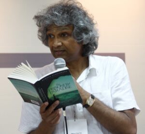Romesh Gunesekera reading from a book